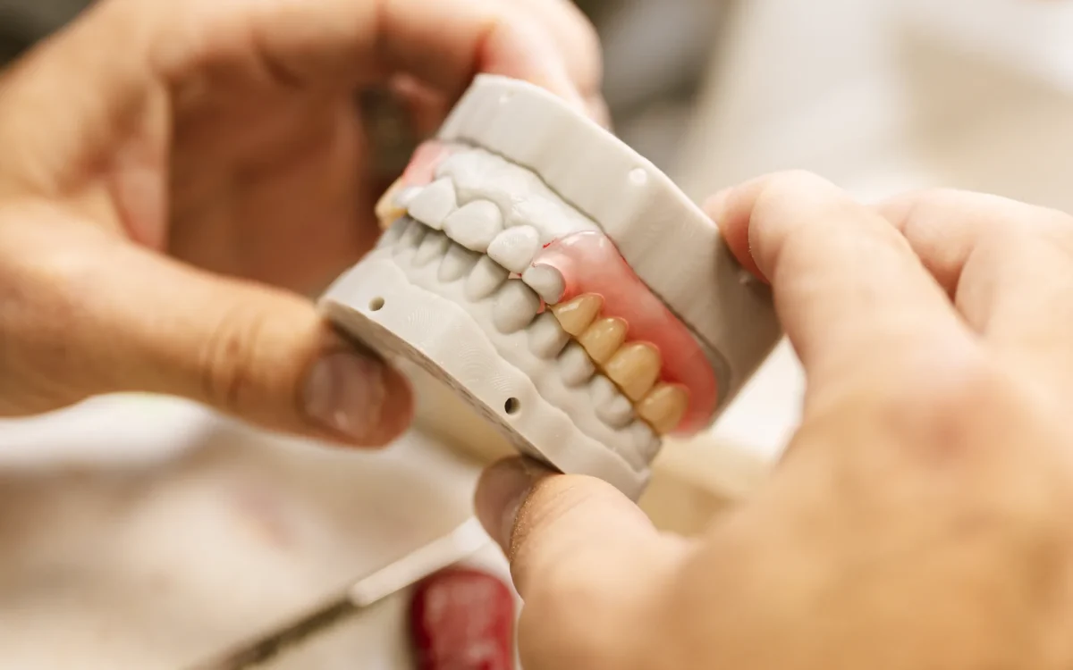 A Valplast flexible partial denture with thermoplastic clasps at the IDA bench