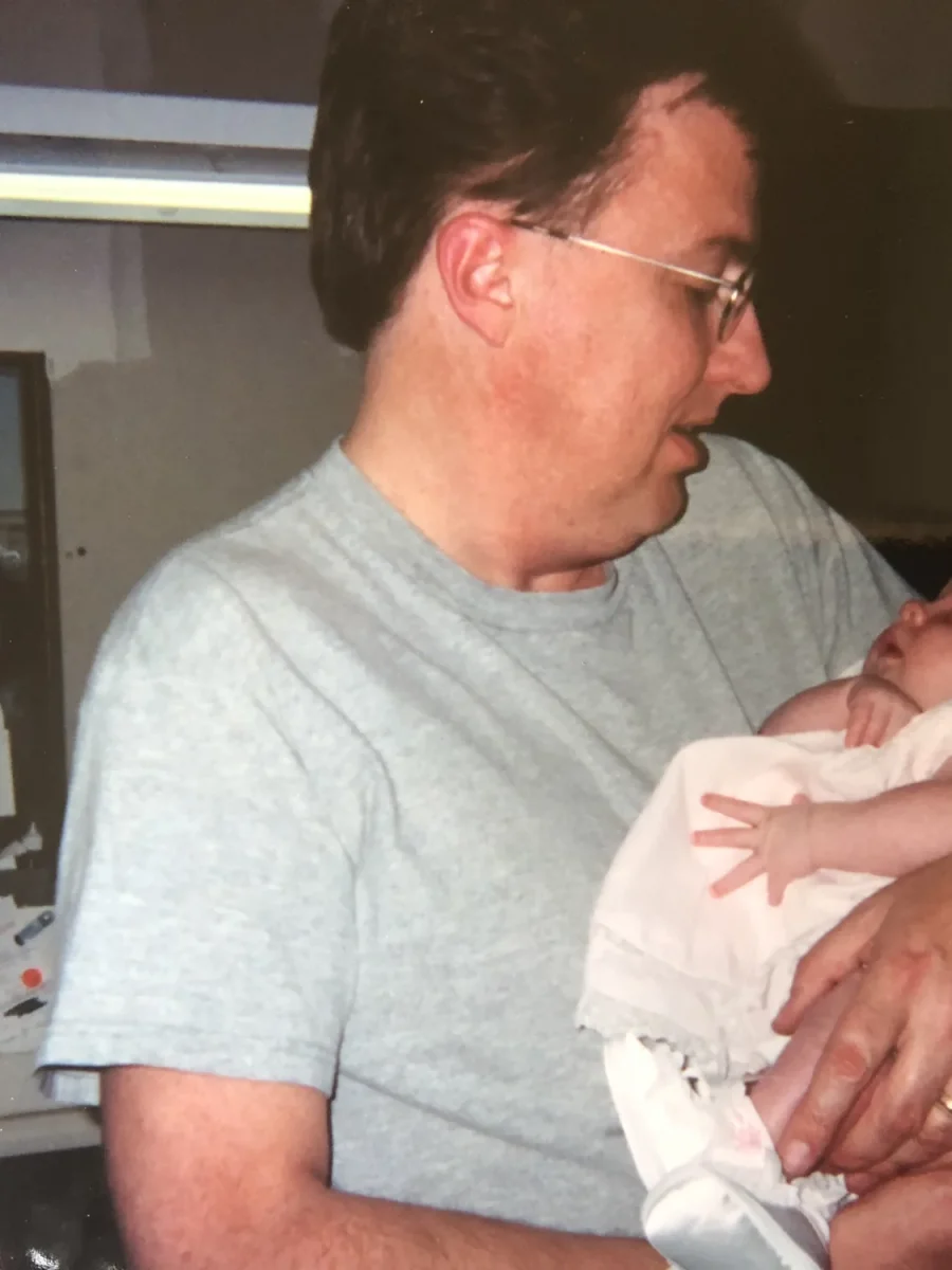 Lance Russell holding infant Amanda inside the IDA lab