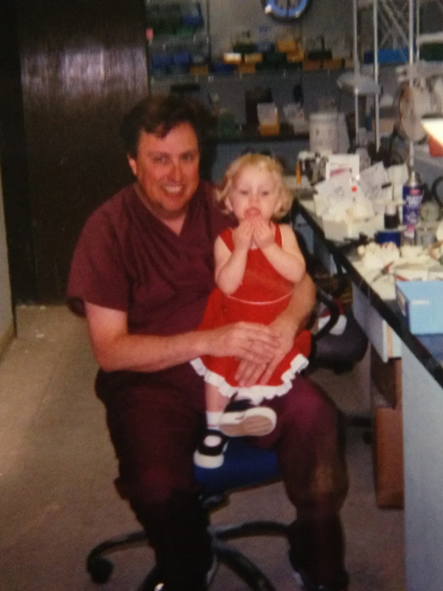 Lance Russell at the lab in IDA's early years, with young Amanda